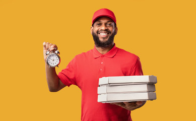 Wall Mural - Courier Delivering Pizza On-Time Holding Boxes And Clock, Yellow Background