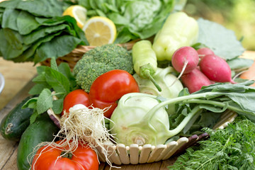 Wall Mural - Healthy fresh organic vegetable in wicker basket on table