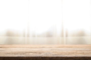 Curtain and window background with empty wooden desk space platform for product presentation.