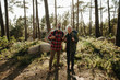 © Criene Images - Elferly fit happy couple hiking through forest together on vacation