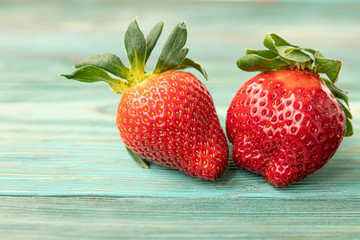 Set of fresh red strawberries on rustic background