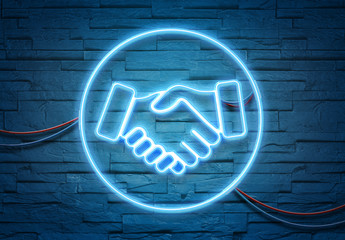 Poster - Handshake neon icon illuminating a brick wall with blue and pink glowing light 3D rendering