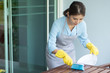 © 9nong - asian woman cleaning home, doing housework with duster