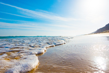 Wall Mural - Bursts of sea waves on a tropical sea beach,