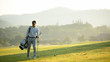 © freebird7977 - Golfer asian man walking in fairway with bag golf with club in sunlight.  Hobby in holiday and vacation, greed club golf background.   Lifestyle and Sport Concept.
