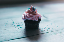 Pink Chocolate Cupcake With Blue Sprinkles, Moody Style 
