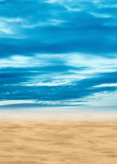 Summer sunny day. Blue sky with yellow sand skyline.