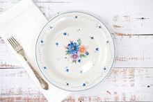 Empty White Plate On Rustic Wooden Table. Decorative Ceramic Plates, Traditional Floral Pattern. Top View.