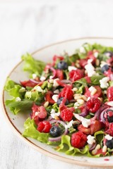 Poster - Salad with berries-raspberry, blueberry, sweet cherry. Dressed with raspberry vinaigrette. Soft focus. copy space