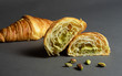 © janckerphoto - Selective focus. Photo of a traditional freshly baked croissant filled with a delicious pistachio cream.
