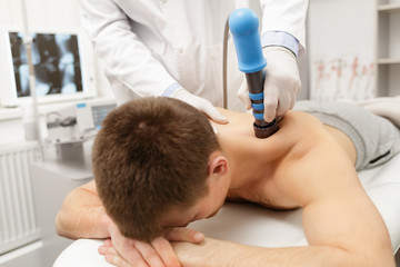 extracorporeal shockwave therapy eswt.non-surgical treatment.physical therapy for neck and back musc