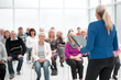 © ASDF - Businesswoman addressing colleagues at office meeting