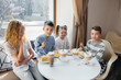 © Andrii - A large friendly company of children celebrate the holiday in a cafe with a delicious dessert. The day of the birth