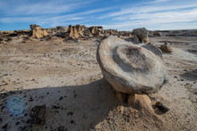 Large Rock Floating On Small Hoodoo In New Mexico Desert