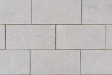 Close Up Small Tiny Stone Pebble In Concrete Block Tile With Running Bond Pattern Floor Texture Background