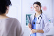 © lenets_tan - Beautiful female doctor explaining medical treatment to a patient