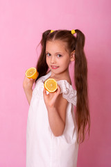 Young attractive girl posing at studio with lemon. Vitamin C