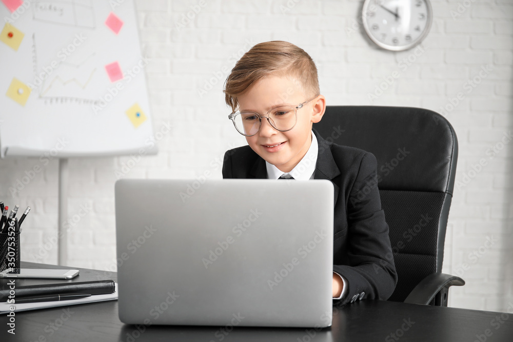 Little secretary working in office