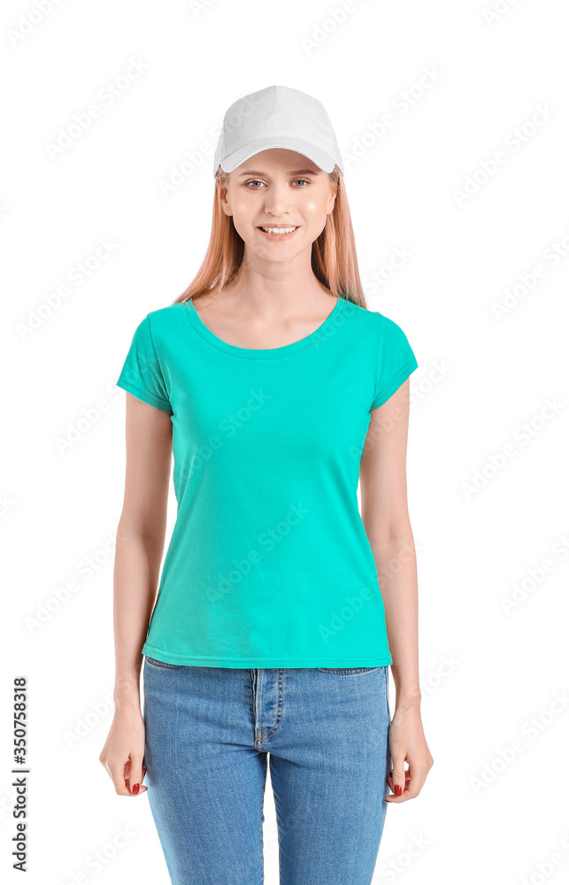 Beautiful young woman in stylish cap on white background