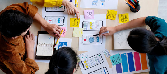 Wall Mural - brainstorm planing creative asian teamwork, group of asia mobile phone app developer team meeting fo