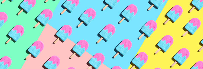 Wall Mural - Pink and blue popsicles with shadow - overhead view