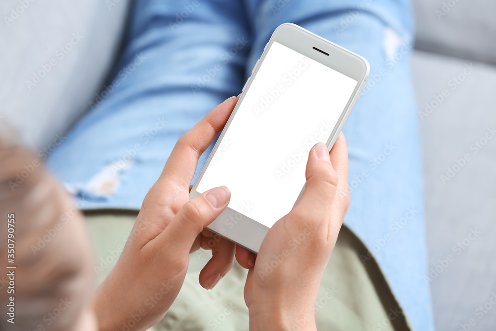 Woman with mobile phone at home