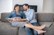 © zinkevych - Young pregnant woman in a jeans jacket feeling great with her husband at home