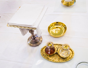 Wall Mural - chalice for wine, blood of christ, and ciborium with host, body of christ, and ampoules with wine and water for consecration