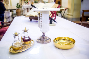 Wall Mural - chalice for wine, blood of christ, and ciborium with host, body of christ, and ampoules with wine and water for consecration