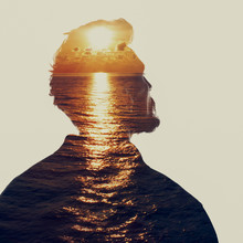 Double Exposure Portrait Of A Man In Contemplation At Sunset Time
