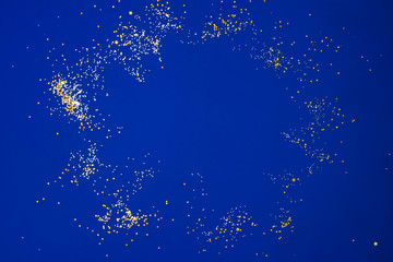 Wall Mural - The magical particle sparkle explosion on blue.