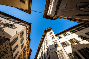 Sticker - Old houses and buildings in the historic center of Florence photographed from below at a road junction. Tuscany, Italy, Europe