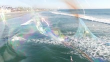 Blowing Soap Bubbles On Ocean Pier In California, Blurred Summertime Background. Creative Romantic Metaphor, Concept Of Dreaming Happiness And Magic. Abstract Symbol Of Childhood, Fantasy, Freedom.