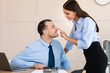 Businesswoman Seducing Male Employee Flirting At Workplace In Modern Office
