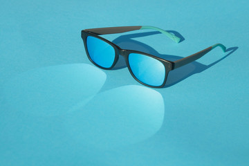 glasses on blue background