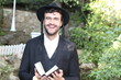 Cute Jewish man smiling outdoors 