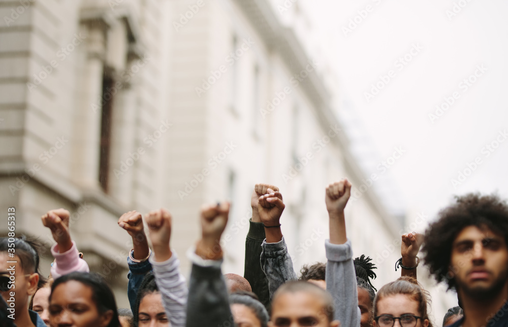 Arms raised in protest - obrazy, fototapety, plakaty 