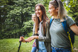 © BalanceFormCreative - Group of female friends hiking in nature.They walking trough forest and meadows.
