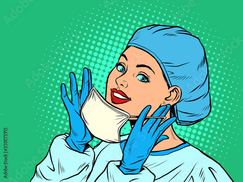 Obraz na plátně female doctor putting on a medical mask