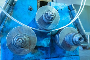 Poster - industrial bending machine for metal pipe bending equipment. tube bend close-up. metalworking. machi