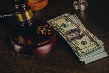 Wall Mural - Close-up Of Wedding Rings And Wooden Gavel.