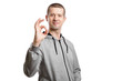 © Arsentyev Vladimir - happy successful man, wearing a hooded jacket, shows the SIGN OK or okey with a hand brush. A look into the camera. Isolated