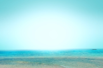 Wall Mural - world oceans day concept: abstract blurred background of ocean beach