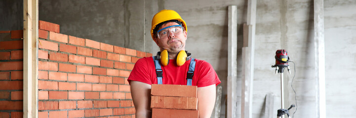 Man in protective helmet and uniform