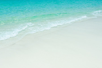 Wall Mural -  Blue sea ocean, water sun reflection, and sand background. Top view