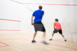 © lightpoet - Squash players in action on a squash court (motion blurred image; color toned image)