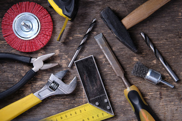 Set of carpenter tools on wooden background