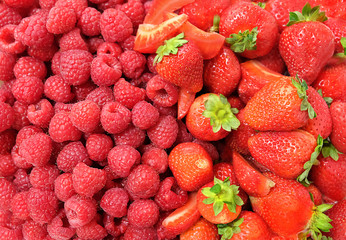 ripe raspberries and strawberries full frame background. close up. sweet fresh red  berry.