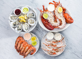 Mixed seafood platter of oysters, lobster and king prawns 