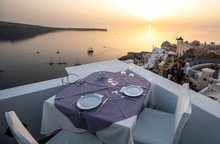 Table And Chairs Near The Beach, Sunset At Santorini